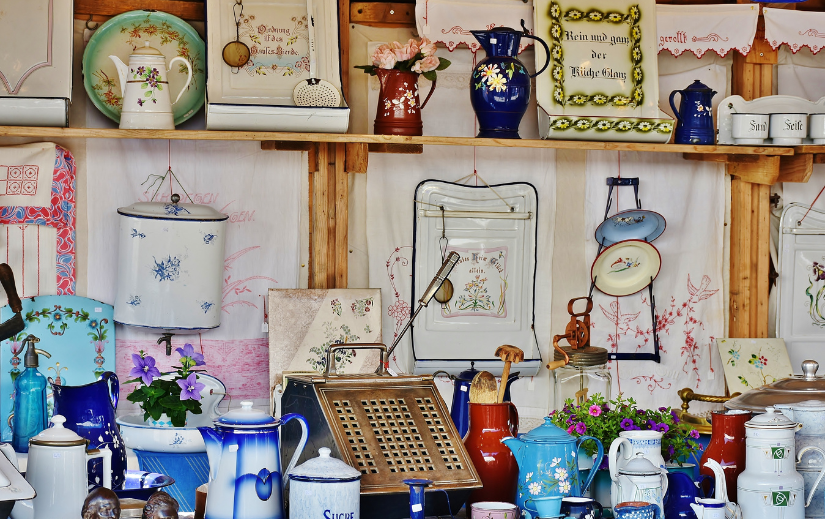 Vintage kitchenware and ceramics at a market stall—perfect for Etsy business tips on selling unique handmade items.